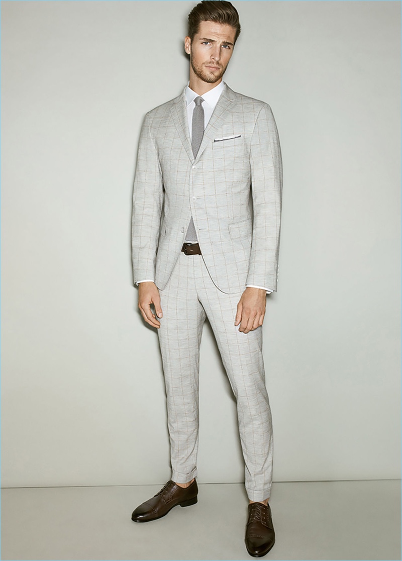 Wearing a pale grey suit, Edward Wilding stars in Joop!'s spring-summer 2017 lookbook.