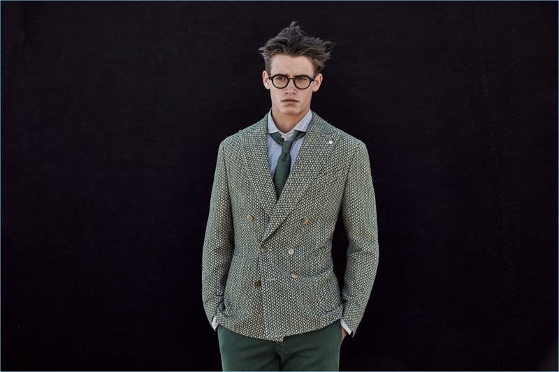 Wearing glasses, Sascha Wolf sports a dashing green suiting look from L.B.M. 1911.