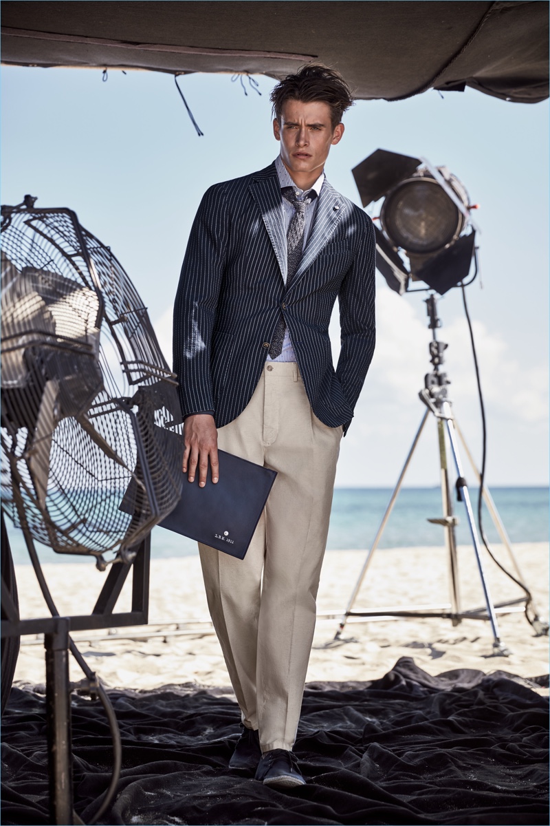 L.B.M. 1911 curates a sartorial season with must-haves such as a navy pinstripe blazer and khaki trousers.