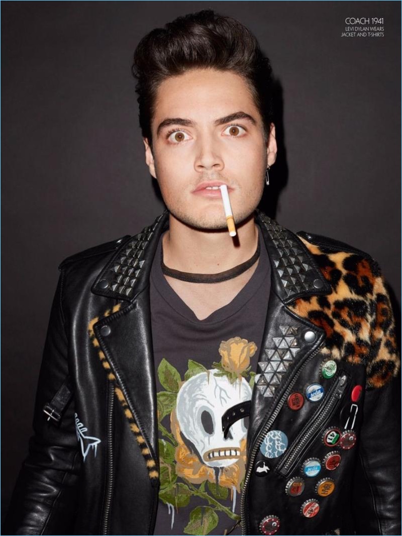 Levi Dylan rocks a leather biker jacket and graphic t-shirt from Coach 1941.