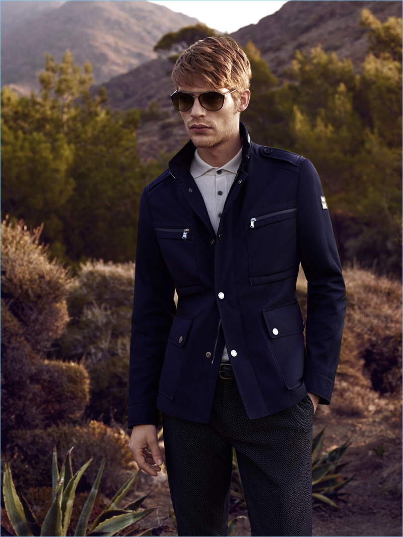 Baptiste Radufe sports a navy field jacket from Lufian's spring-summer 2017 collection.