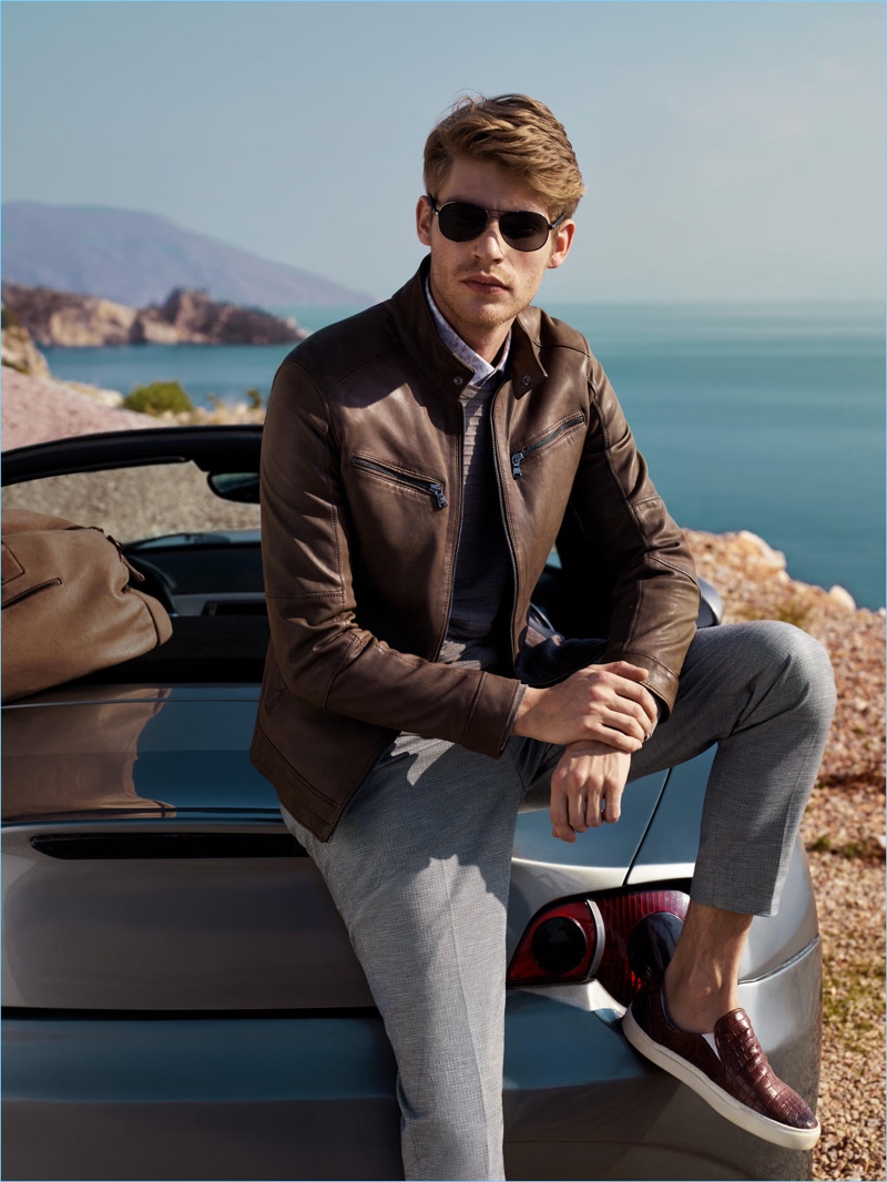 French model Baptiste Radufe is a cool vision in a brown leather jacket from Lufian.