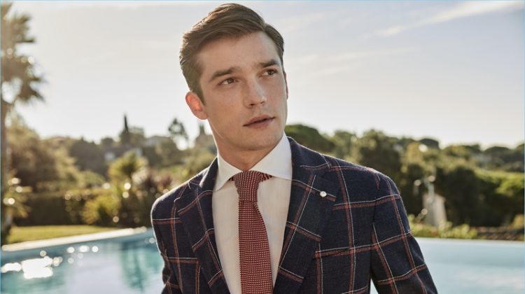 Alexis Petit dons a windowpane print blazer from Luigi Bianchi Mantova's spring-summer 2017 collection.