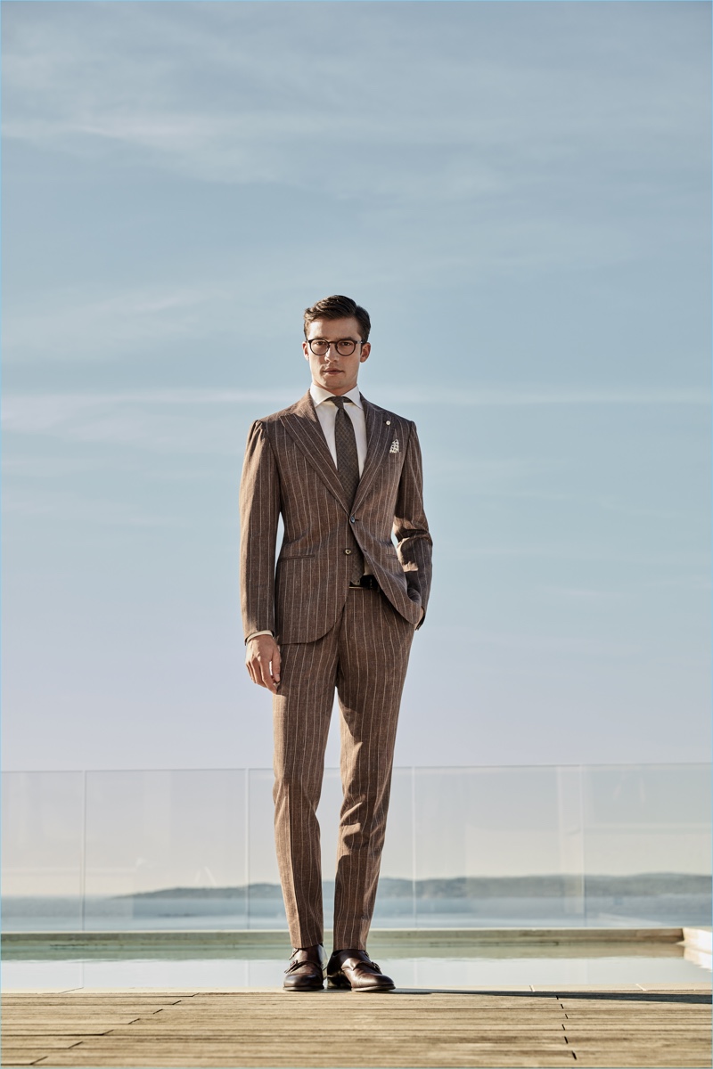 Standing tall, Alexis Petit wears a pinstripe suit from Luigi Bianchi Mantova's spring-summer 2017 collection.