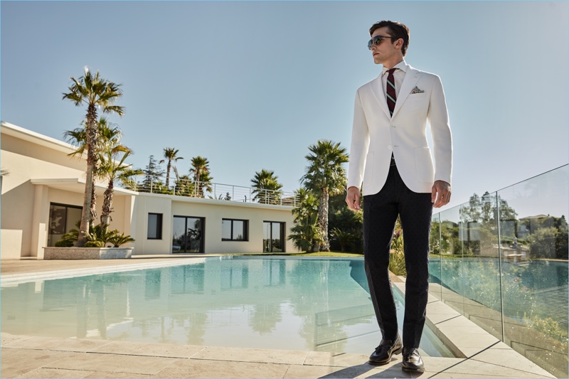 Wearing a crisp white and black number, Alexis Petit dons smart suiting separates by Luigi Bianchi Mantova.