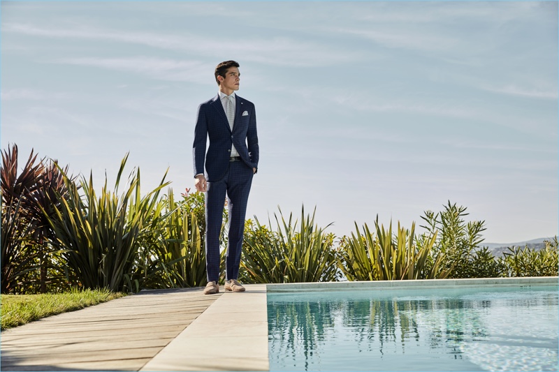 Model Alexis Petit sports a check blue suit from Luigi Bianchi Mantova.