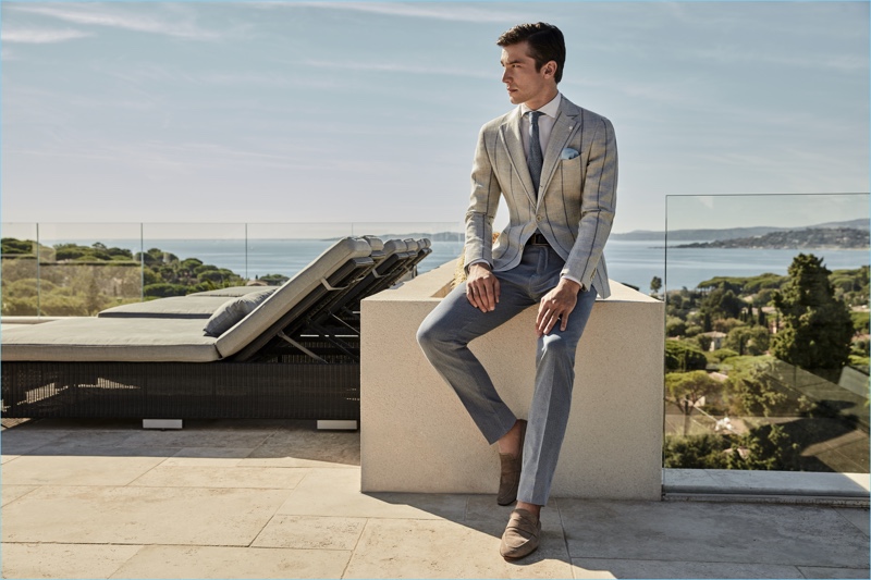 Donning shades of grey, Alexis Petit wears a sartorial number from Luigi Bianchi Mantova.