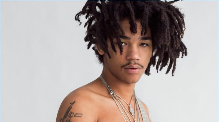 Luka Sabbat wears overalls from Raf Simons' Robert Mapplethorpe collection. He also sports Stella McCartney jeans and his own jewelry.