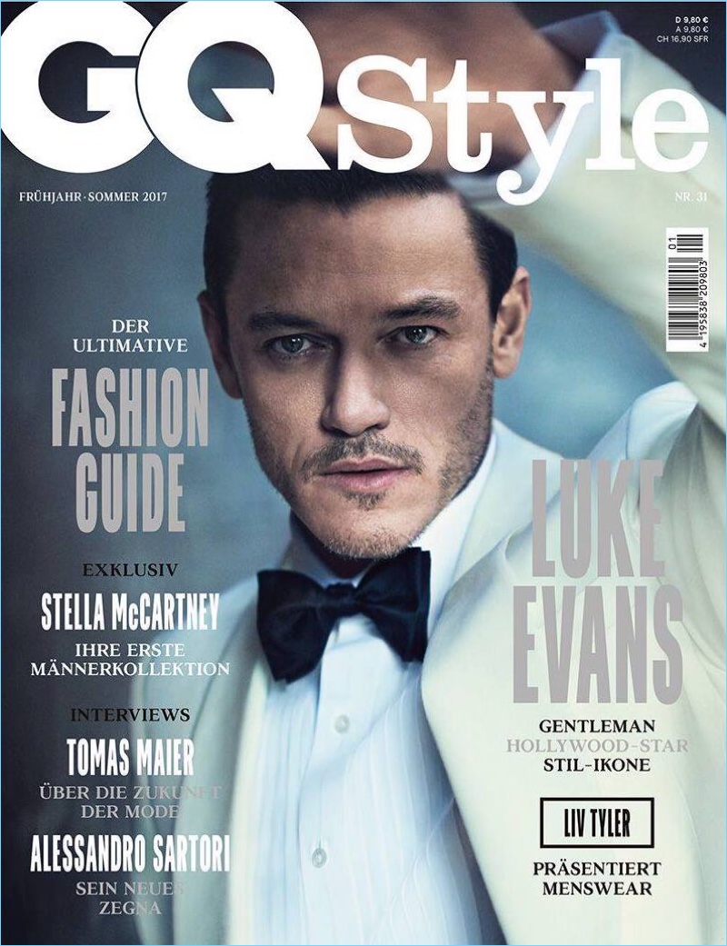 Luke Evans wears an off-white tuxedo jacket and black bow-tie for the cover of GQ Style Germany.