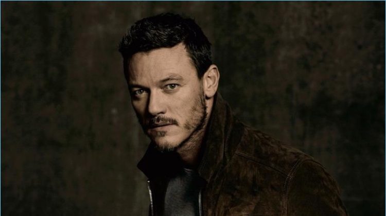 Luke Evans wears a t-shirt and suede jacket by AMI with Citizens of Humanity jeans.