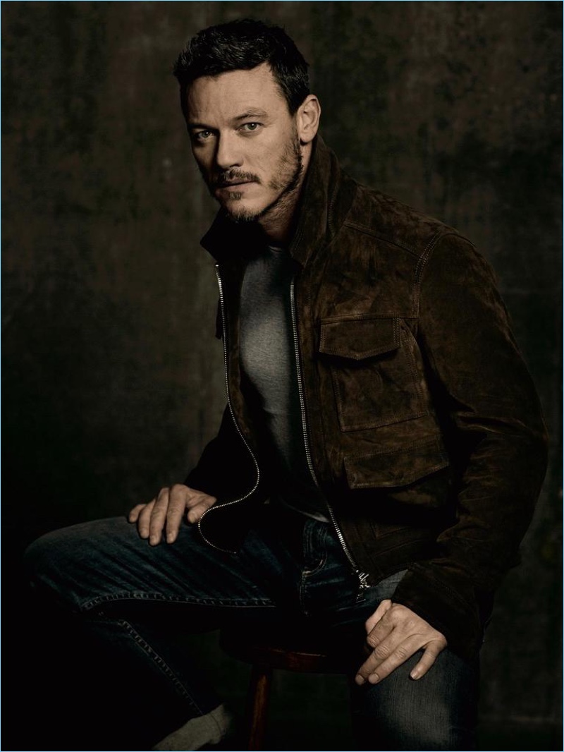 Luke Evans wears a t-shirt and suede jacket by AMI with Citizens of Humanity jeans.