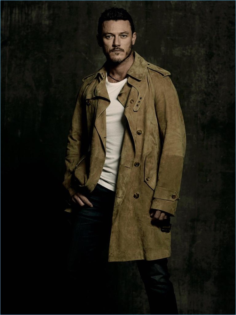Actor Luke Evans wears a Ralph Lauren Purple Label coat with a Lot 78 t-shirt, and Citizens of Humanity jeans.