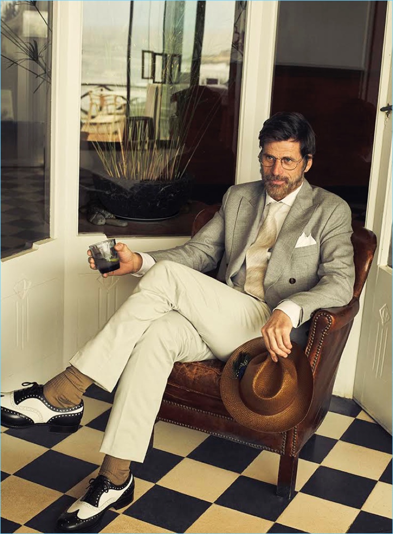 Sergi Pons photographs Mark Vanderloo in a double-breasted blazer by Brunello Cucinelli. Mark also sports a BOSS shirt with Hermes pants, an Emporio Armani hat, and Church's shoes.