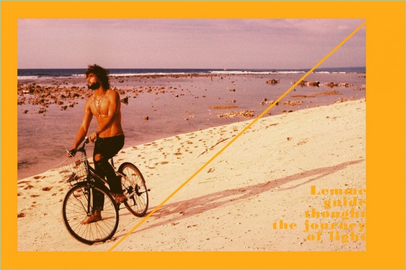 Marlon Teixeira takes to the beach for a bike ride.