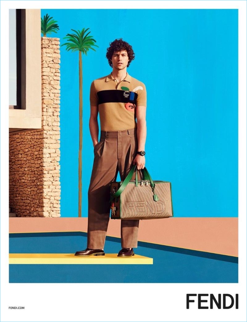 Miles McMillan holds a Fendi two-tone striped travel bag $2,900 for the brand's spring-summer 2017 campaign.