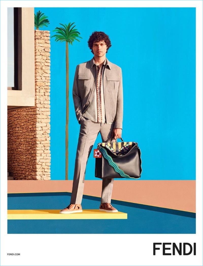 Miles McMillan wears a Fendi Damier-pattern jacket $1,450 and trousers $500 for Fendi's spring-summer 2017 campaign.