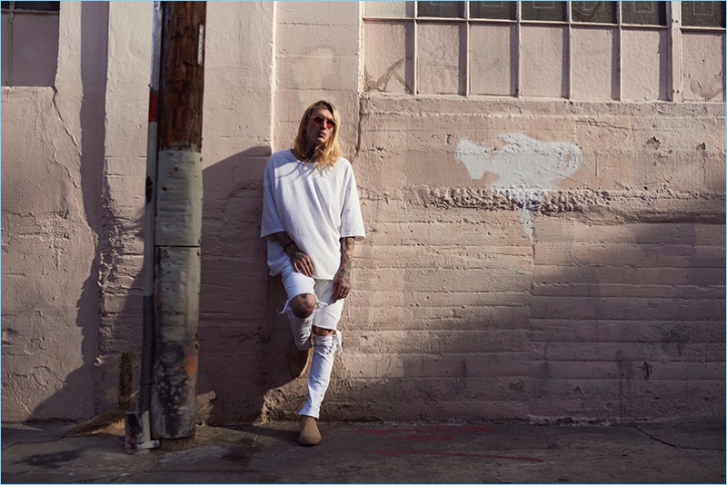 Anthony Vaughan photographs Bradley Soileau in an oversized t-shirt and white ripped jeans from Other UK.