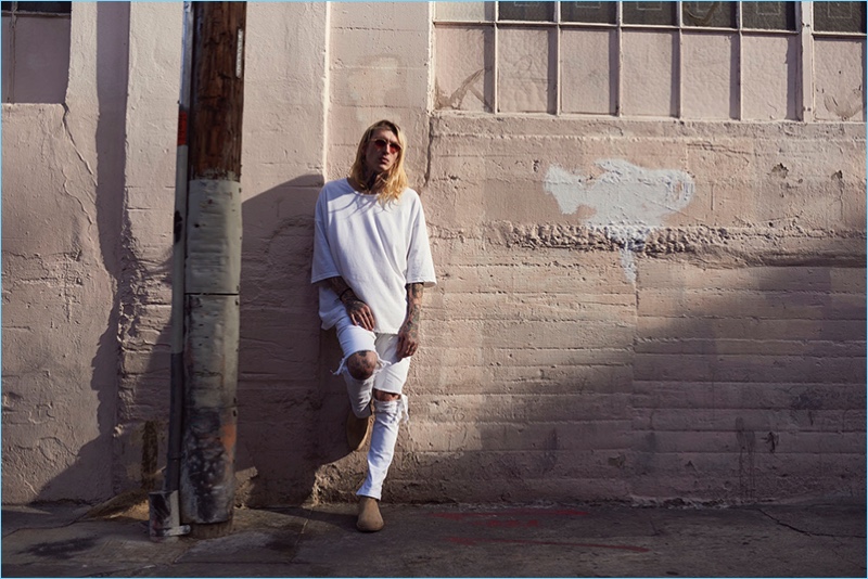 Anthony Vaughan photographs Bradley Soileau in an oversized t-shirt and white ripped jeans from Other UK.