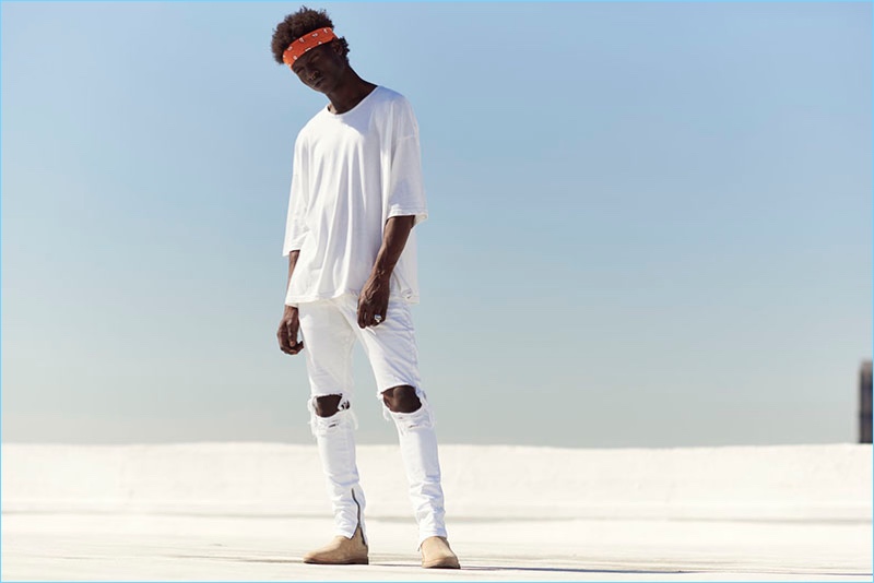 A style standout, Adonis Bosso sports white fashions from Other UK.