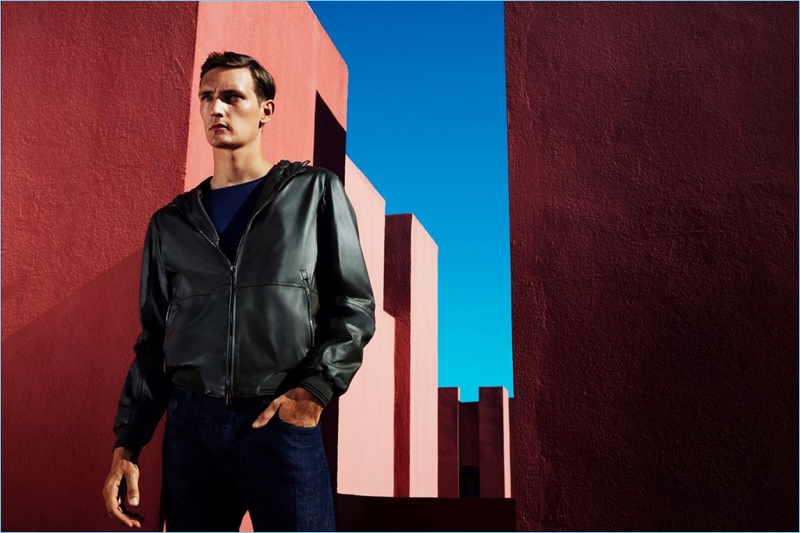 Model Yannick Abrath sports a hooded leather jacket from Pal Zileri.