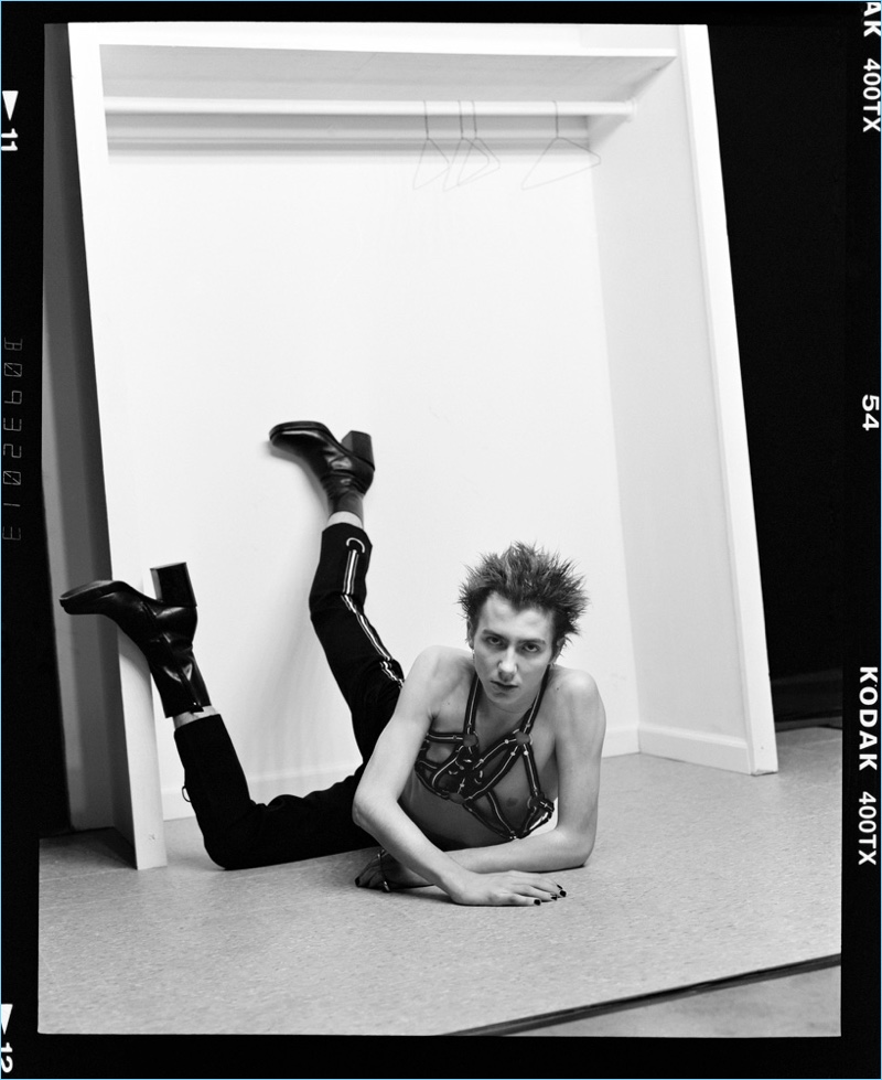 Tapping into a rebellious edge, Paul Hameline rocks a harness and pants by Dior Homme with Balenciaga boots.