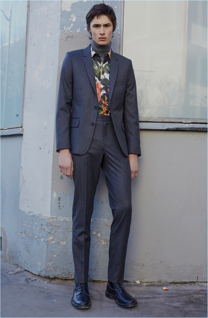 Suiting receives a fresh look with a turtleneck sweater and floral print shirt from Paul & Joe.