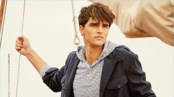 Setting sail, Pepe Barroso Silva models a POLO Ralph Lauren jacket with a Bench hoodie and Springfield pants.