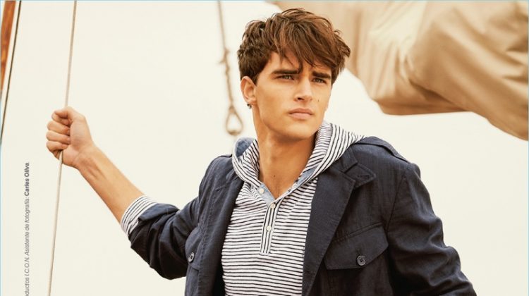 Setting sail, Pepe Barroso Silva models a POLO Ralph Lauren jacket with a Bench hoodie and Springfield pants.