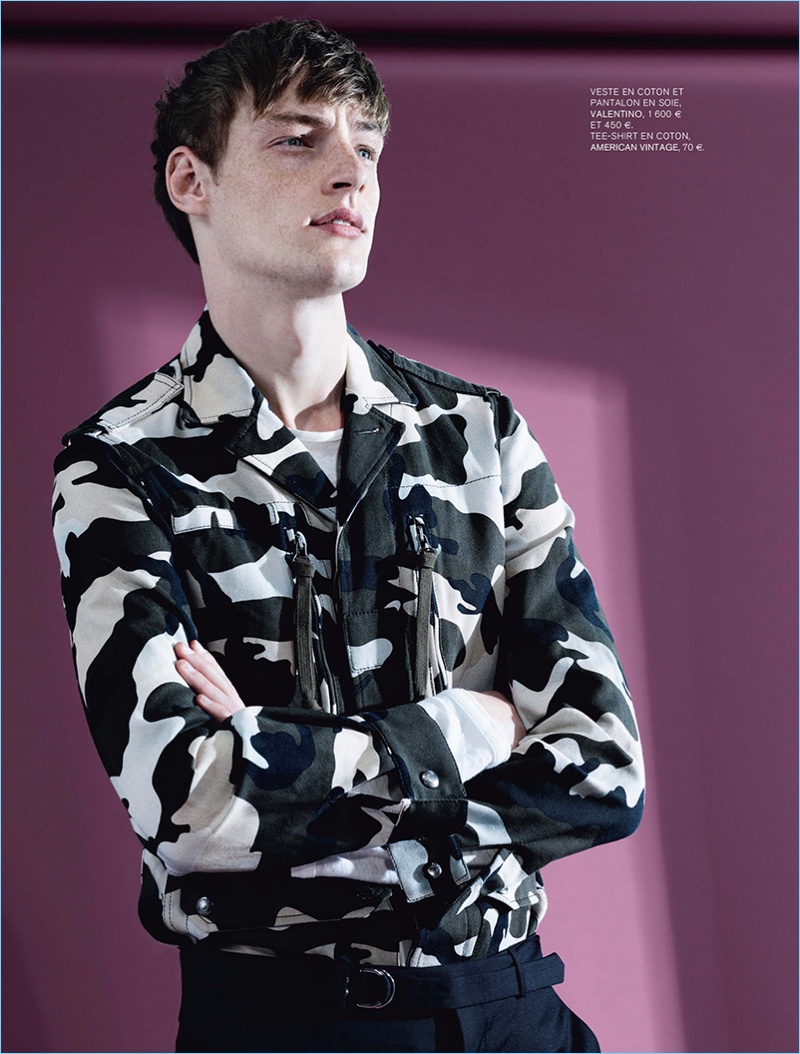 Model Roberto Sipos rocks a camouflage jacket with trousers by Valentino.