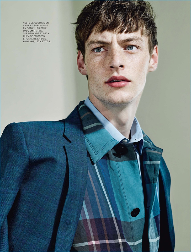 Taking to the studio, Roberto Sipos wears a blazer and check jacket from Paul Smith.