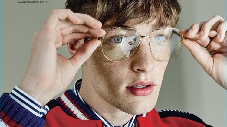 Wearing Gucci, Roberto Sipos adjusts his oversized glasses.