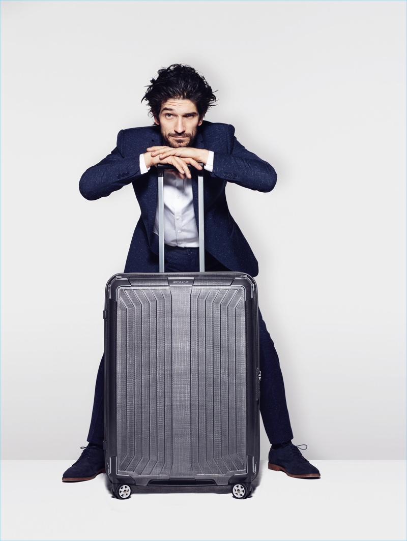 Jonathan poses with Samsonite's spinner luggage.