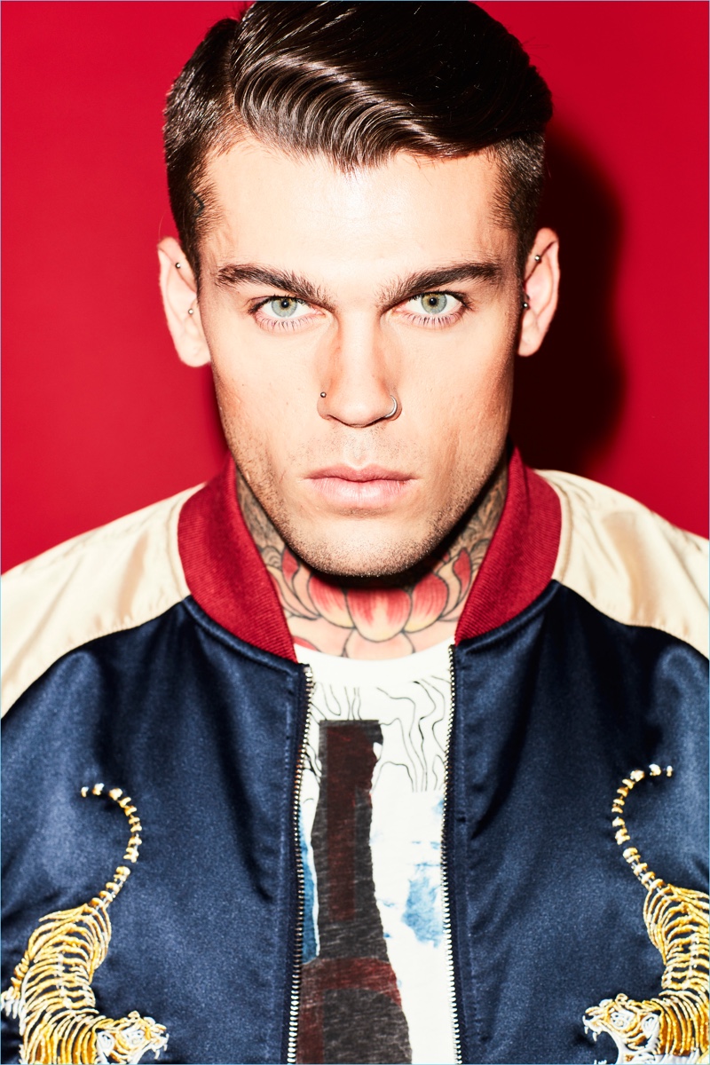 Front and center, Stephen James wears a Jack & Jones bomber jacket with Replay jeans and a Nudie Jeans t-shirt.