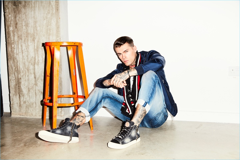 Model Stephen James sports an Autark jacket with a Tigha t-shirt and Diesel jeans.