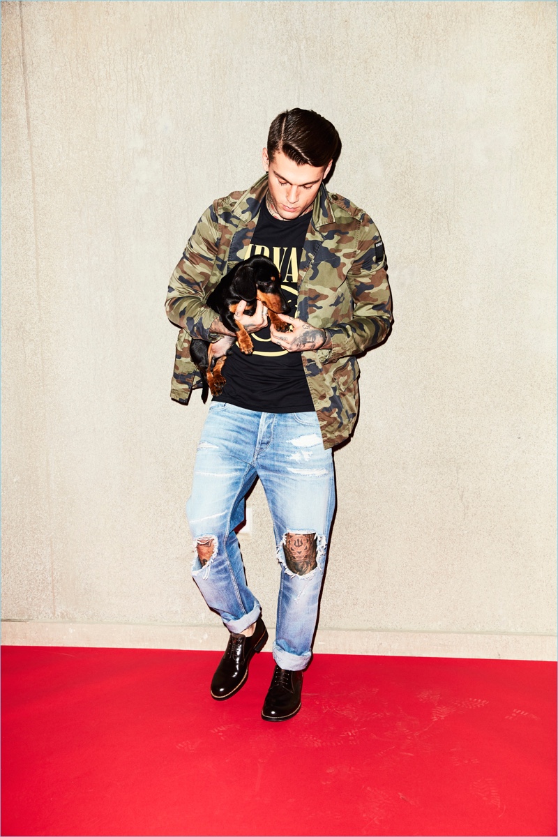 Making a camouflage statement, Stephen James wears a Replay jacket and jeans with a Jack & Jones Nirvana t-shirt.