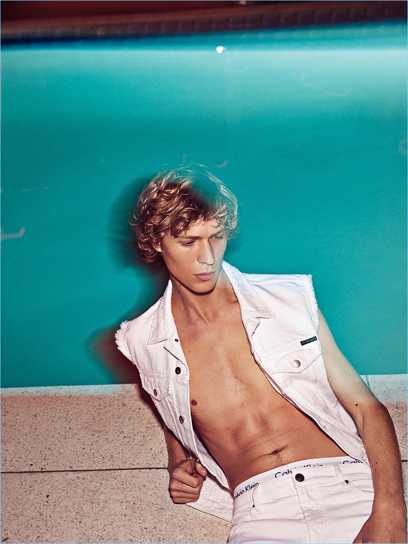 Appearing in an editorial for GQ España, Sven de Vries wears a white denim look by Calvin Klein Jeans.