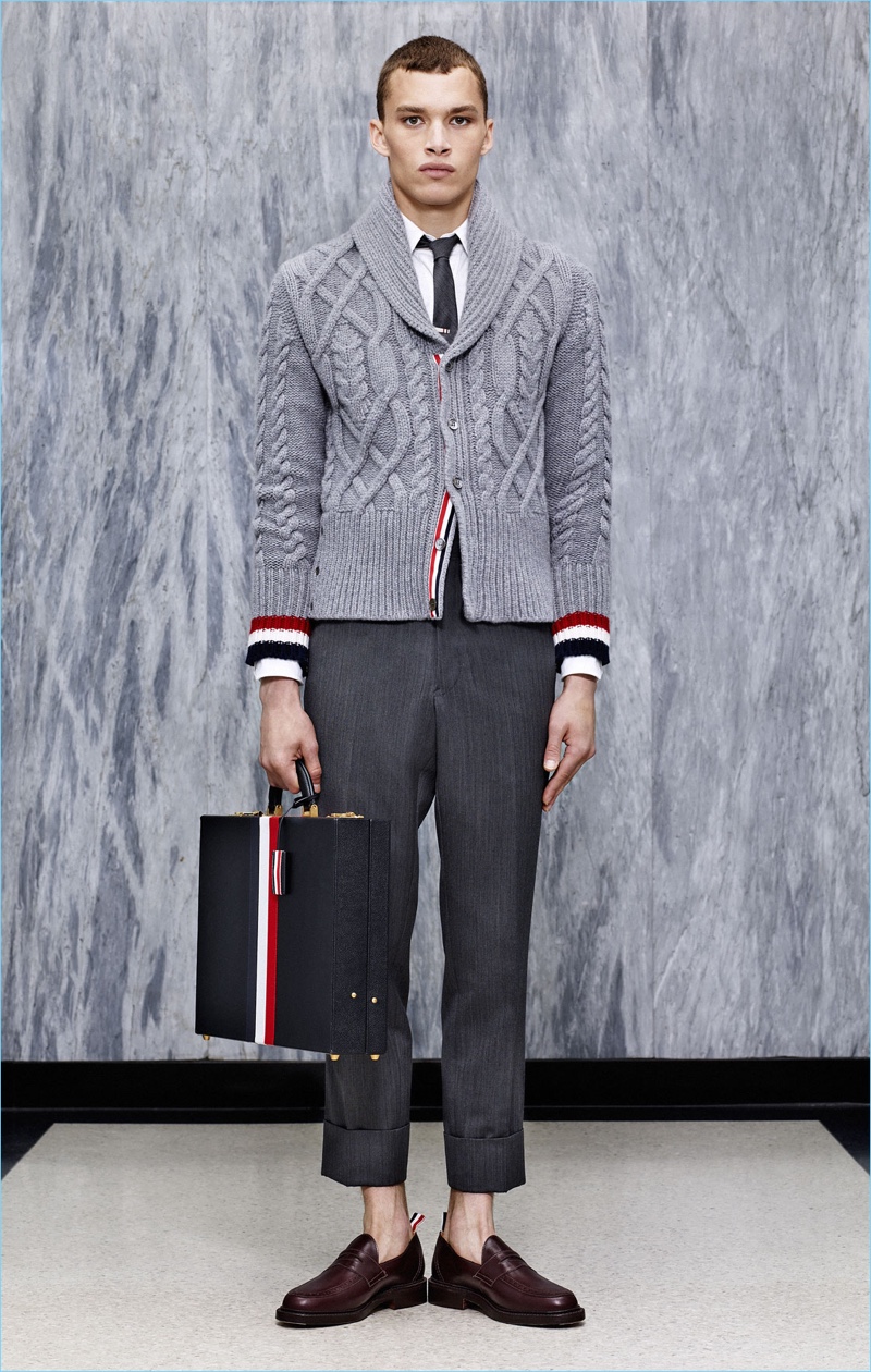 The shawl cable-knit sweater is front and center with cropped trousers from Thom Browne's spring-summer 2017 collection.