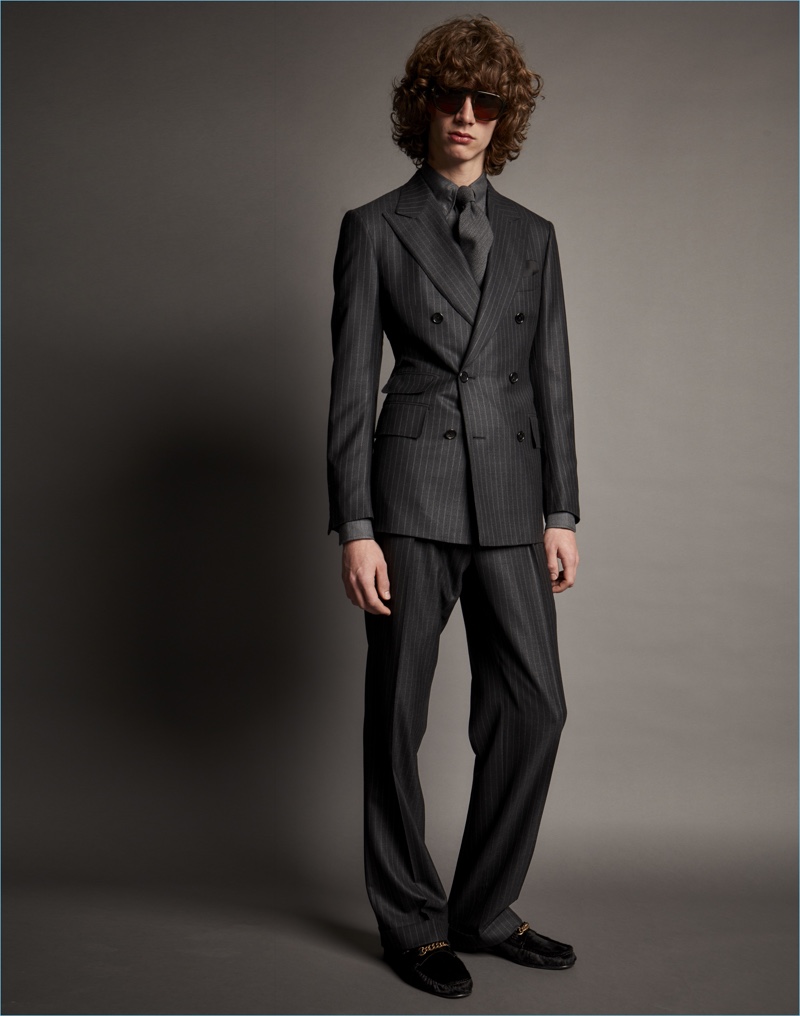 Luxury label Tom Ford turns out a double-breasted pinstripe suit for fall-winter 2017.