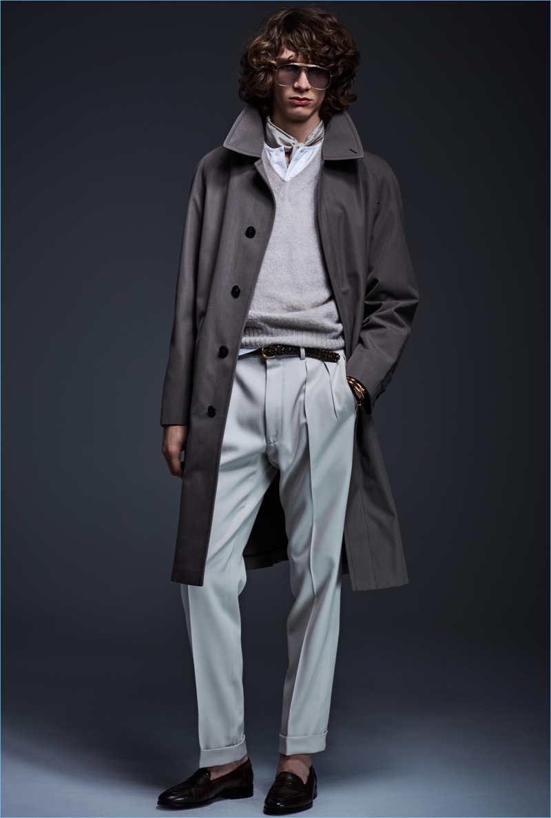 Model Erik van Gils is dashing in a coat and pleated trousers by Tom Ford.