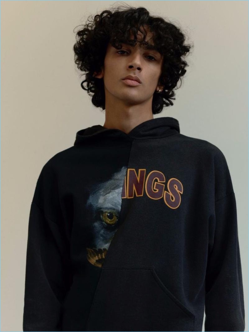 Sporting a black Eagle Kings print spliced hoodie, Callum Stoddart connects with Topman for spring.