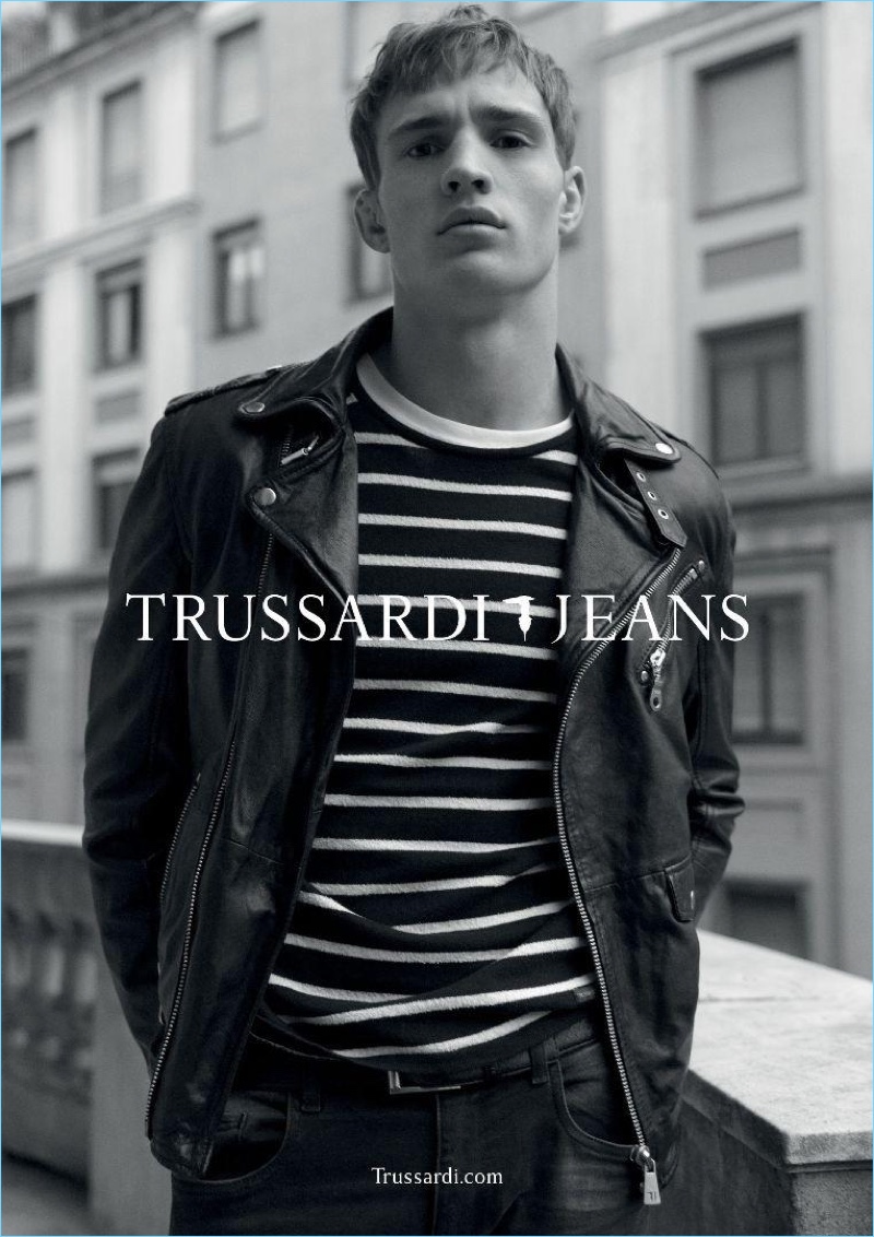 Model Julian Schneyder rocks a leather biker jacket and striped pullover for Trussardi Jeans' spring-summer 2017 campaign.