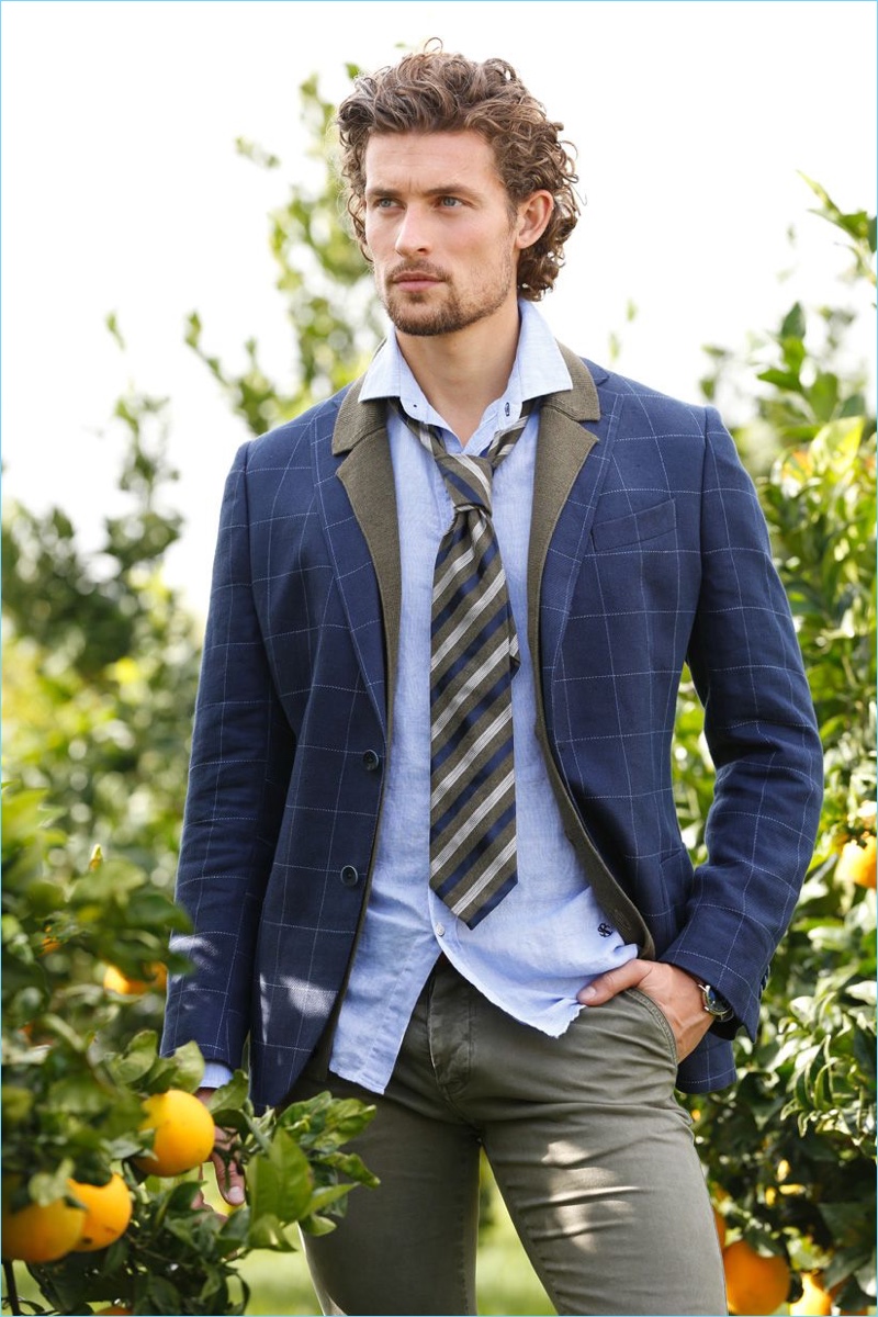 Wouter Peelen embraces prep style with a windowpane print blazer and smart styles.