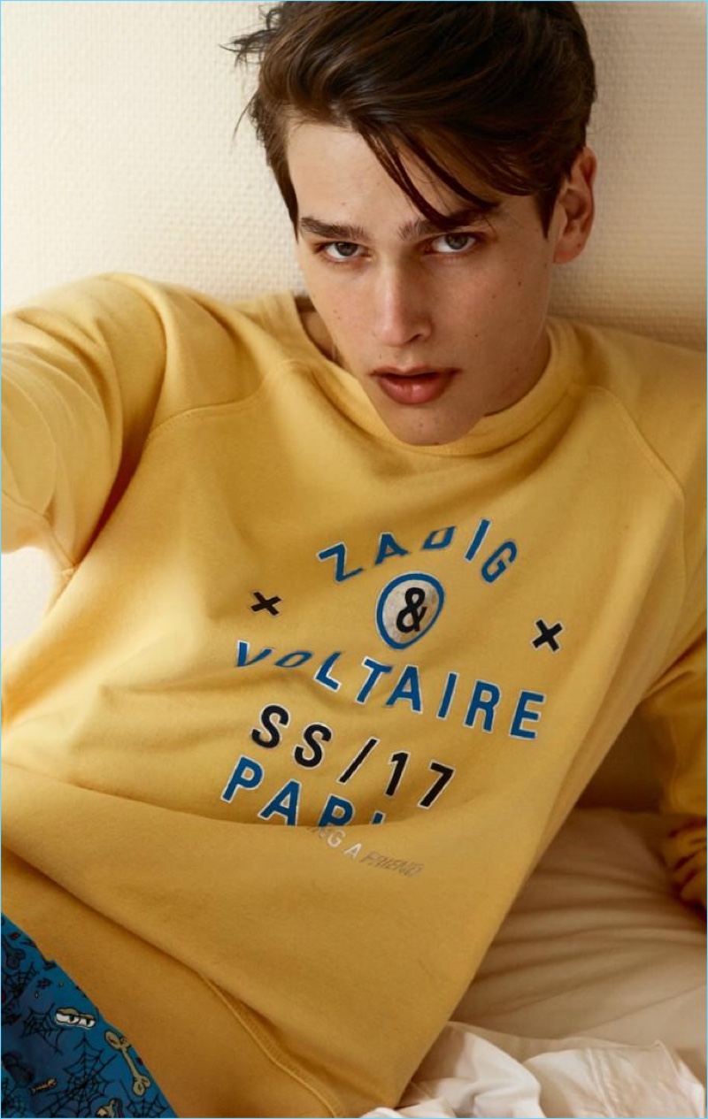 Going casual, Simon van Meervenne wears a yellow Zadig & Voltaire sweatshirt.