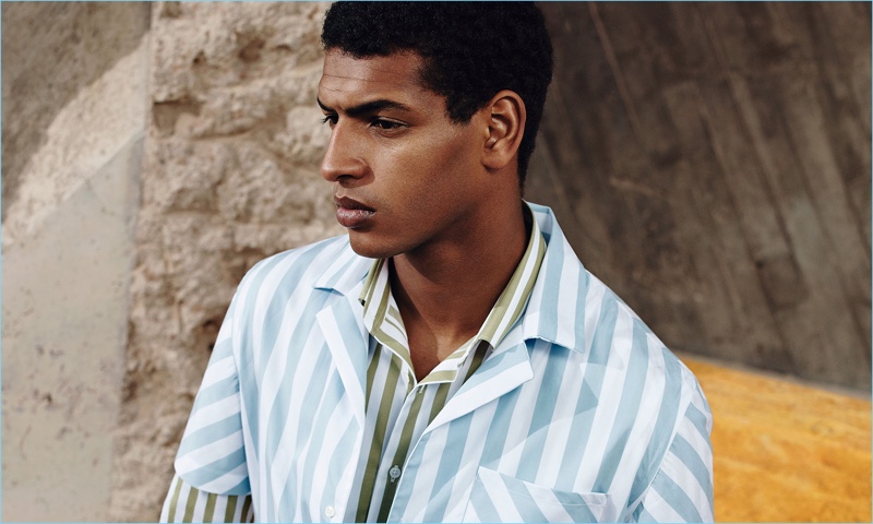 Tidiou M'Baye embraces spring pastels with striped shirts from Zara Man.