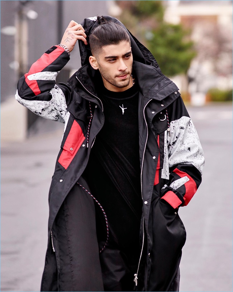 Singer Zayn Malik wears an Alexander Wang pullover with a Dior Homme parka. The Pillowtalk singer also sports parachute trousers with a Neo chain necklace and bracelet by Louis Vuitton.