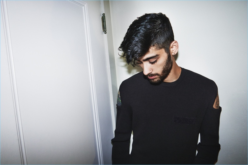 Singer Zayn Malik rocks a knit with shoulder cut-outs for Versus Versace's spring 2017 campaign.