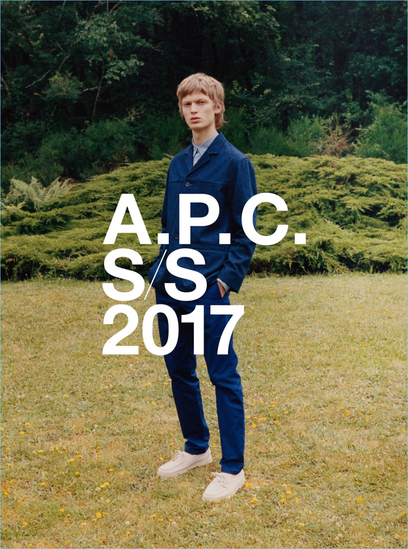 Venturing outdoors for A.P.C.'s spring-summer 2017 campaign, Jonas Glöer sports a navy Hunt jacket $660 with slim-fit denim jeans $195.