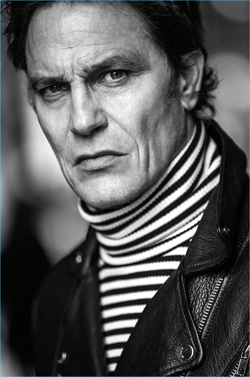 Model Andre Van Noord dons a striped turtleneck and leather biker jacket for El Burgués' fall-winter 2017 campaign.