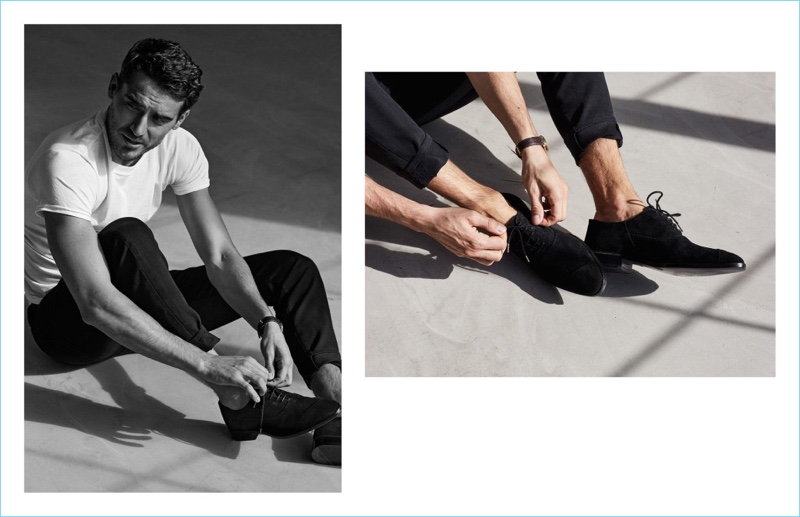 Arthur Kulkov laces up a pair of Between Rivers asymmetrical cap toe oxford shoes in black.