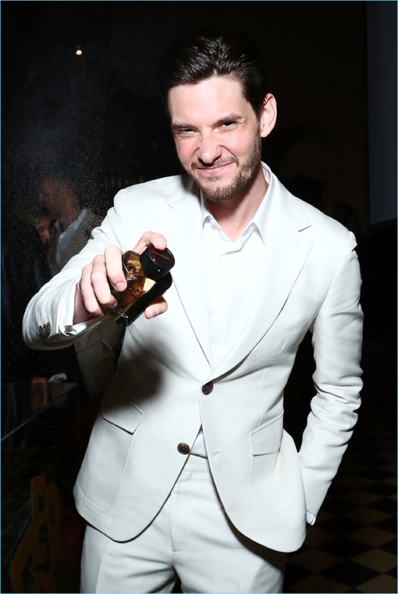 Hosting an event for Salvatore Ferragamo Uomo Casual Life in New York, Ben Barnes sprays a splash of the new fragrance.